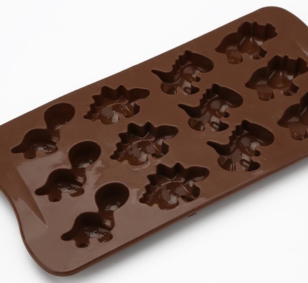 El chocolate del silicón del día de fiesta del dinosaurio moldea el color de Brown no dañino